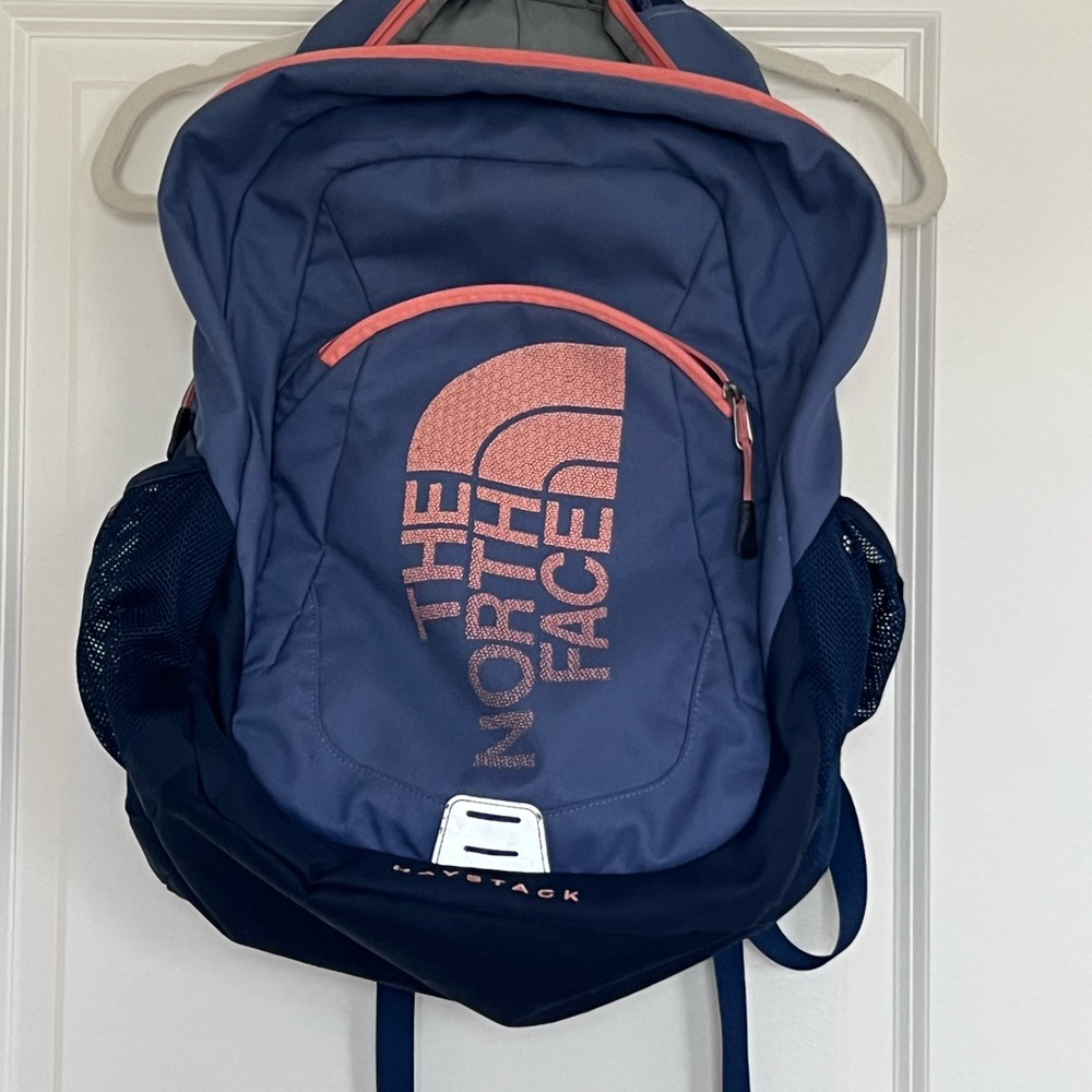 The North Face Blue Backpack with Pink Accents